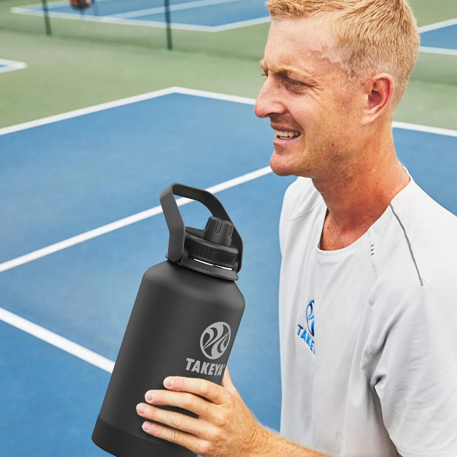 Takeya Pickleball Stainless Steel Insulated Water Bottle with Choice of Lid and Carry Handle, 64 Ounce, Dropshot Teal